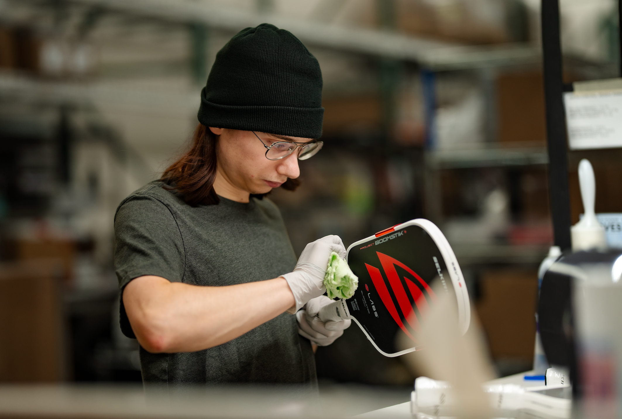 A Selkirk engineer adds an edge guard to the Project Boomstik paddle. 